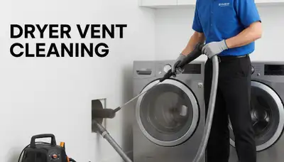 Technician providing professional dryer vent cleaning service in Washington, DC home